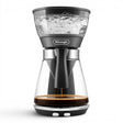 Taghareed De'Longhi ICM17210 black glass filter coffee maker with 1.25L carafe, brewing coffee.