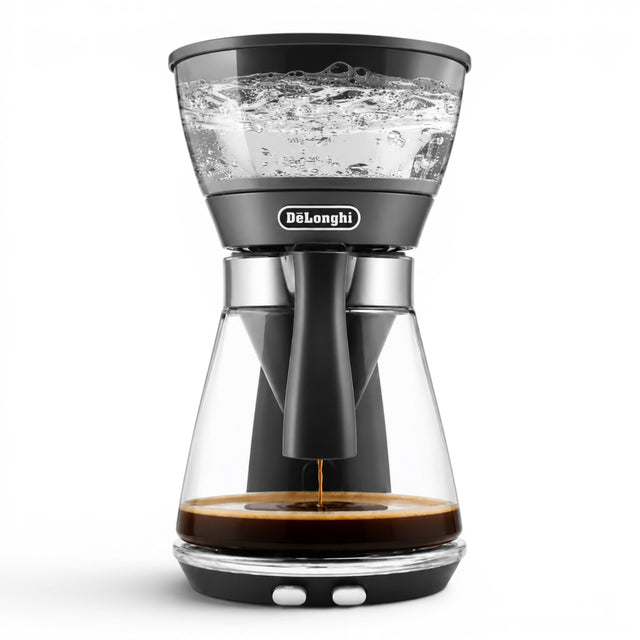 Taghareed De'Longhi ICM17210 black glass filter coffee maker with 1.25L carafe, brewing coffee.