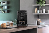 Taghareed De'Longhi Magnifica S compact black automatic coffee machine with built-in grinder and steam wand, brewing two espressos.