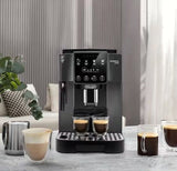 Taghareed De’Longhi Magnifica Start automatic coffee machine with touch controls, brewing espresso into two glasses.