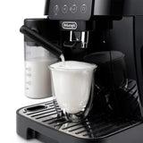 Taghareed De'Longhi Magnifica Start automatic coffee machine frothing milk into a glass.