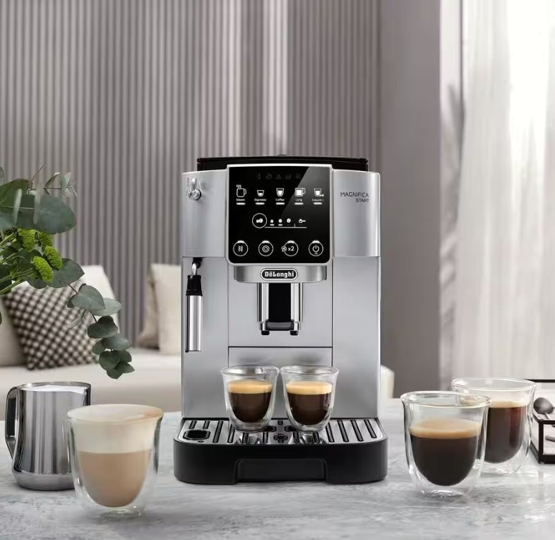 Taghareed De'Longhi Magnifica Start automatic coffee machine in silver with a touch screen and milk frother, brewing two espressos.