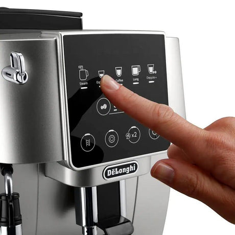 Taghareed De'Longhi Magnifica Start automatic coffee machine with touch screen interface, silver finish.