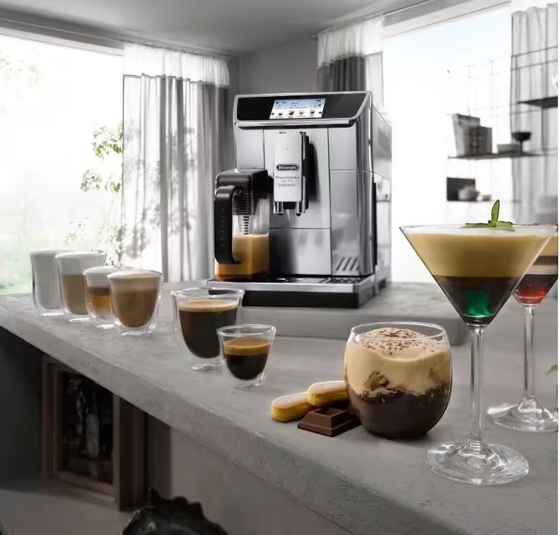 Taghareed De’Longhi PrimaDonna Elite stainless steel automatic coffee machine with touch screen, making various coffee drinks.