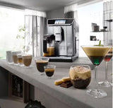 Taghareed De’Longhi PrimaDonna Elite stainless steel automatic coffee machine with touch screen, making various coffee drinks.