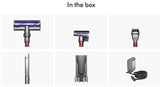 Taghareed Dyson cordless vacuum cleaner attachments: main brush head, mini motorized tool, crevice tool, wand, wall dock, and charger.