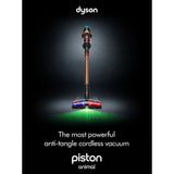 Taghareed Dyson V16 Piston Animal Submarine cordless vacuum in copper and black with illuminated brush head cleaning green particles.