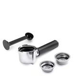Taghareed De'Longhi ECP 35.31 espresso machine portafilter with two baskets and a black coffee scoop.