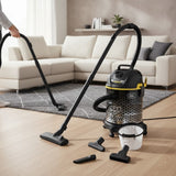Taghareed Kärcher 1800W 20L barrel vacuum cleaner with blower function, black and yellow, with accessories on wooden floor.