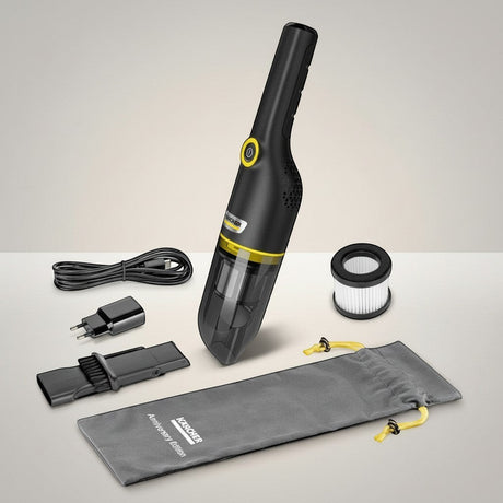 Taghareed Kärcher CVH 4 Black cordless hand vacuum cleaner with accessories, including USB cable, charger, crevice tool, filter, and storage bag.
