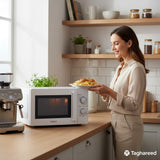 Taghareed white 20L Kenwood microwave oven with mechanical controls and defrost function, perfect for quick meal prep.