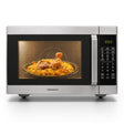 Taghareed Kenwood MWM42.000BK 42L digital microwave with grill, 1100W, stainless steel, cooking biryani and chicken.