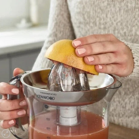 Taghareed Kenwood JE290 citrus juicer with 1L capacity, 40W motor, and stainless steel filter. Features two-way rotation for efficient juicing.