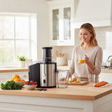 Taghareed Kenwood JEM02.A0BK Accent Collection 800W centrifugal juicer in stainless steel and black, with wide chute and pulp bin.