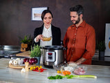 Taghareed Kenwood 16-in-1 electric pressure cooker 8L multicooker PCM80 in silver and black with digital display and 16 smart programs.