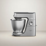 Taghareed Kenwood Titanium Chef Baker XL stand mixer in silver, 1200W, 7L bowl, planetary mixing, and LightLift head.