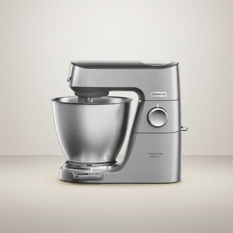 Taghareed Kenwood Titanium Chef Baker XL stand mixer in silver, 1200W, 7L bowl, planetary mixing, and LightLift head.