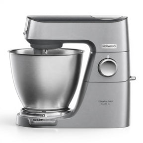 Taghareed Kenwood Titanium Chef Baker XL stand mixer in silver, with a 7L stainless steel bowl and planetary mixing system.