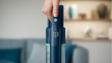 Taghareed Philips 5000 Series Cordless Vacuum Aqua XC5041/61, dark blue with aqua accents, digital display showing 100% battery.