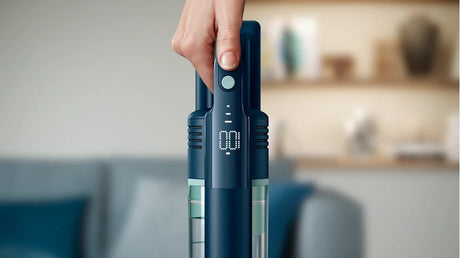 Taghareed Philips 5000 Series Cordless Vacuum Aqua XC5041/61, dark blue with aqua accents, digital display showing 100% battery.