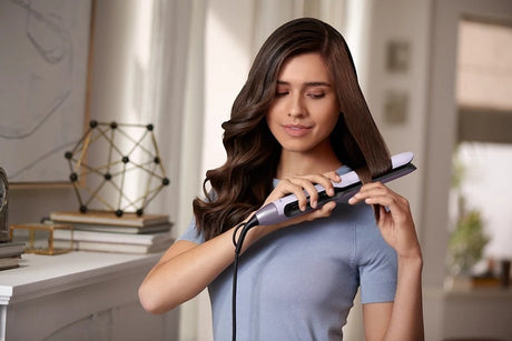 Taghareed Philips 5000 Series straightener with ThermoShield technology and 2x Ionic Care for sleek, shiny hair.