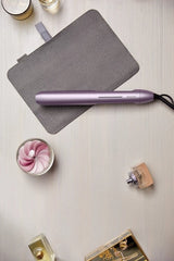 Taghareed Philips 5000 Series purple hair straightener with ThermoShield technology and 2x Ionic Care.
