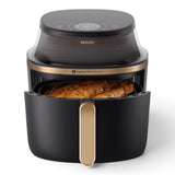 Taghareed Philips Airfryer 3000 Series XL NA342/09 with a whole chicken inside, featuring a digital display and RapidAir Plus technology.
