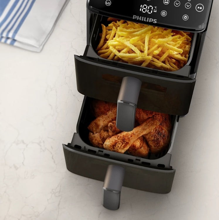 Taghareed Philips Airfryer 4000 Series stacked dual basket with fries in top basket and chicken in bottom basket.