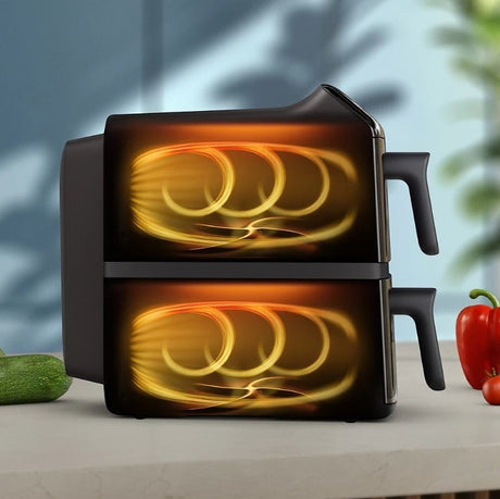 Taghareed Philips Airfryer 4000 Series dual basket stacked design, 10L capacity, black with transparent cooking windows.