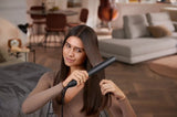 Taghareed Philips 5000 Series BHS510 black hair straightener with argan-oil infused plates and Ionic Care.