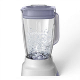 Taghareed Philips 5000 Series Blender Core HR2221/01 with 2L capacity, 700W motor, and ProBlend Crush technology, crushing ice.