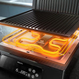 Taghareed Philips 7000 Series contact grill with digital controls and 8 preset programs. Features non-stick plates and 180-degree opening.