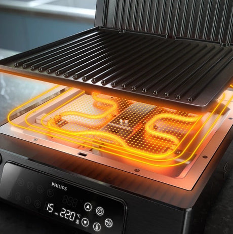 Taghareed Philips 7000 Series contact grill with digital controls and 8 preset programs. Features non-stick plates and 180-degree opening.