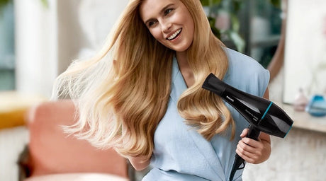 Taghareed Philips DryCare Pro Hairdryer 2100W with ionic care for smooth, shiny hair. Professional AC motor.