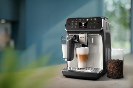 Taghareed Philips 4400 Series espresso machine with LatteGo system, making a latte macchiato. Features TFT display.