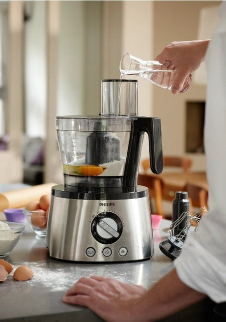 Taghareed Philips 7000 Series food processor in stainless steel with a large bowl and multiple attachments, ideal for chopping, blending, and kneading.
