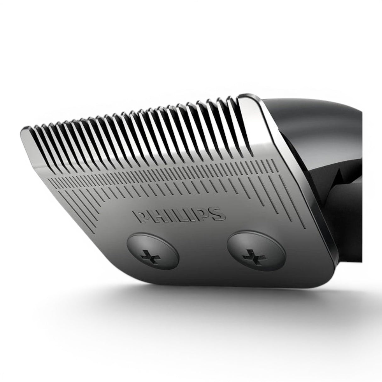 Taghareed Philips Hairclipper Series 3000 HC3100/13 close-up of stainless steel blades with comb attachments.