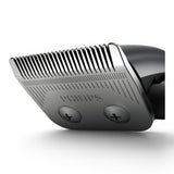 Taghareed Philips Hairclipper Series 3000 HC3100/13 close-up of stainless steel blades with comb attachments.
