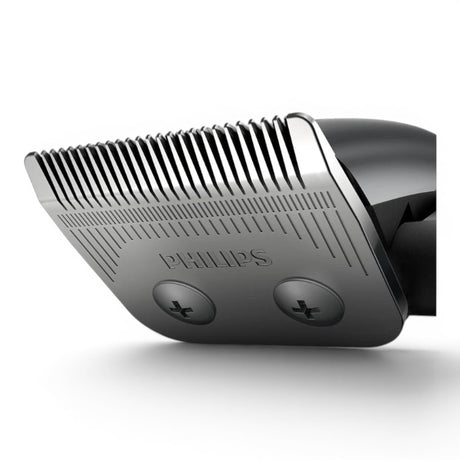 Taghareed Philips Hairclipper Series 3000 HC3100/13 close-up of stainless steel blades with comb attachments.