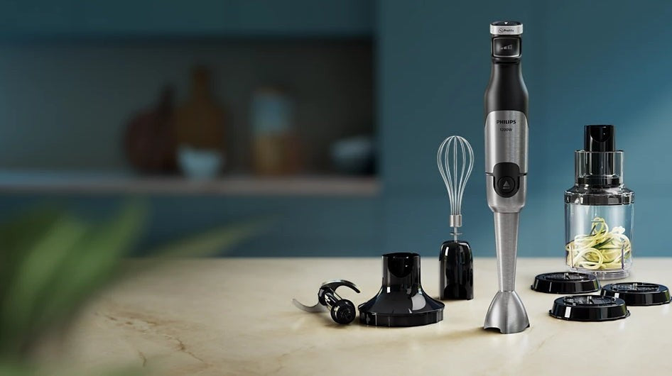 Taghareed Philips 5000 Series hand blender with 1200W motor, ProMix, SpeedTouch, whisk, chopper, and beaker.