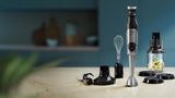 Taghareed Philips 5000 Series hand blender with 1200W motor, ProMix, SpeedTouch, whisk, chopper, and beaker.