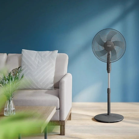 Taghareed Philips Series 600 pedestal fan in dark grey with 3 speeds and 80° oscillation, ideal for living rooms.