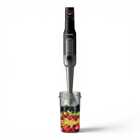 Taghareed Philips Viva Collection ProMix hand blender with 800W motor, SpeedTouch control, and anti-splash guard, shown with fruit in a beaker.