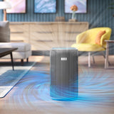 Taghareed Philips Smart Air Purifier 4200 Series AC4220/12, white and silver, with vertical slats, purifying air in a living room.