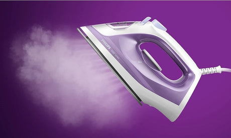 Taghareed Philips 1000 Series steam iron, white and purple, with steam emitting from the soleplate.