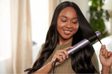 Taghareed Philips 5000 Series straightener with ThermoShield technology and 2x Ionic Care for sleek, shiny hair.