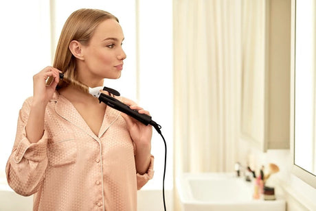 Taghareed Philips StyleCare Essential Curler BHB862, 16mm barrel, ceramic coating, creating defined bouncy curls.