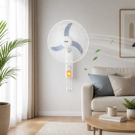 Taghareed Sona WF-550 white wall fan with blue blades and pull cord control, mounted on a wall above a sofa.